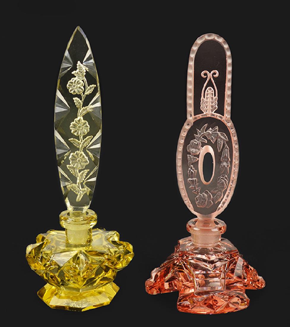 Two Czechoslovakian Pink and Yellow Crystal Perfume: Two Czechoslovakian Pink and Yellow Crystal Perfume Bottles. Irice yellow crystal bottle with a tapering intaglio floral stopper (6.5â€). Marked with the Irice foil label and Czechoslovakia. Togeth