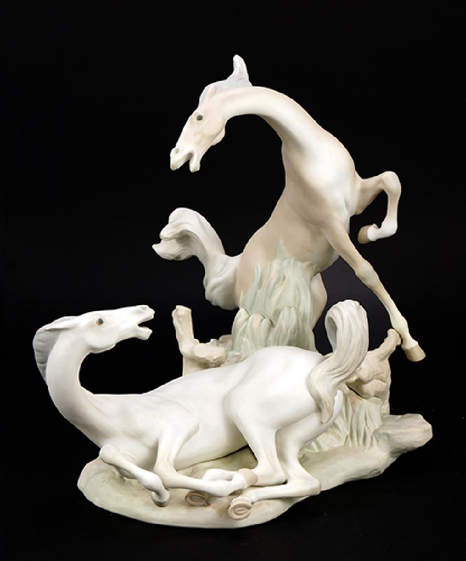 A Lladro Porcelain Figure of 'Two Horses'.