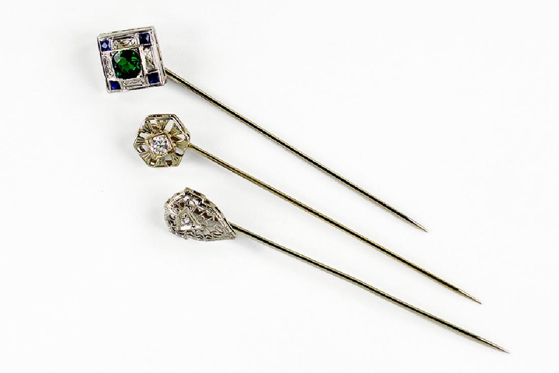 A Tsavorite Garnet and Sapphire Stick Pin. (1 of 1)