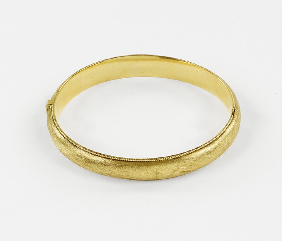 A 14 Karat Brushed Yellow Gold Bangle Bracelet. (1 of 1)