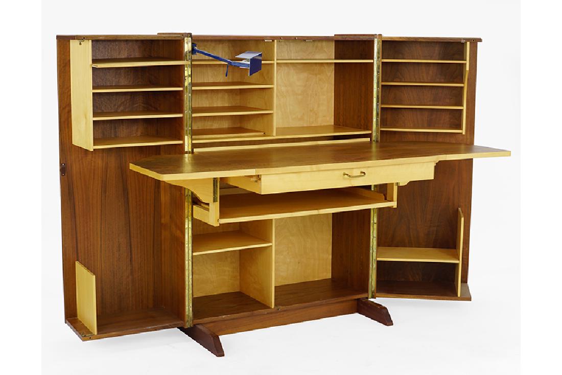 A Teak Hideaway Desk. (1 of 2)