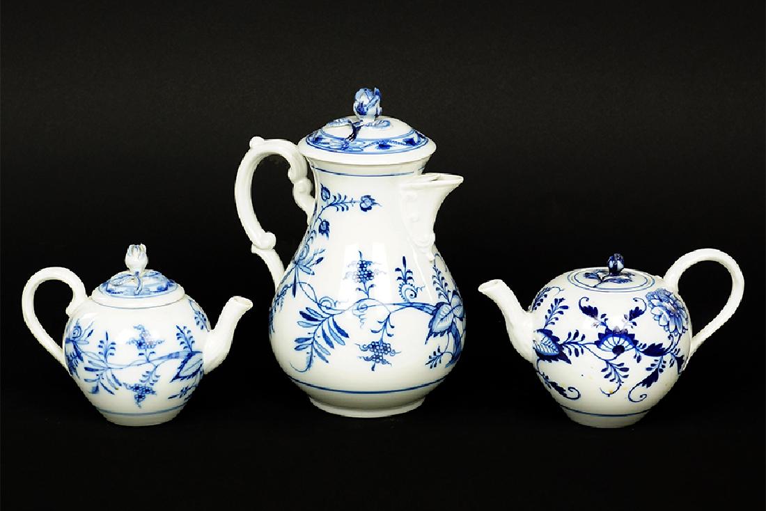 A Meissen Porcelain Blue Onion Teapot.: A Meissen Porcelain Blue Onion Teapot. Bearing a Meissen crossed swords mark. Together with a porcelain coffee pot and teapot in a blue onion style pattern bearing an oval which has Meissen stamped wi
