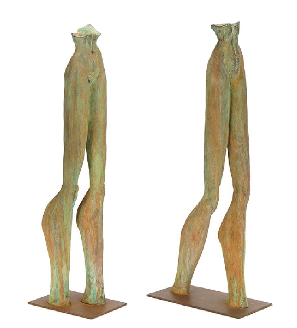 Seger (20th Century) Legs Walking.: Seger (20th Century) Legs Walking. A pair of bronze sculptures with greenish brown patinas, each signed illegibly, dated 98, and bearing an illegible foundry mark, set on a thin bronze base Each Heigh
