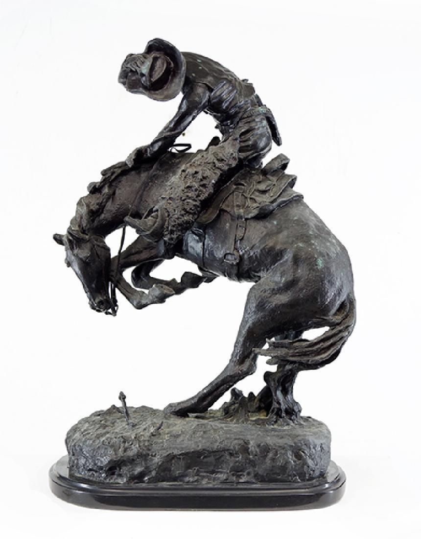 After Frederic Remington (American, 1861-1909): After Frederic Remington (American, 1861-1909) Rattlesnake. Bronze sculpture with black patina, inscribed 'Copyright by Frederic Remington', set on a black base Bronze height: 22.75" Overall: 24"