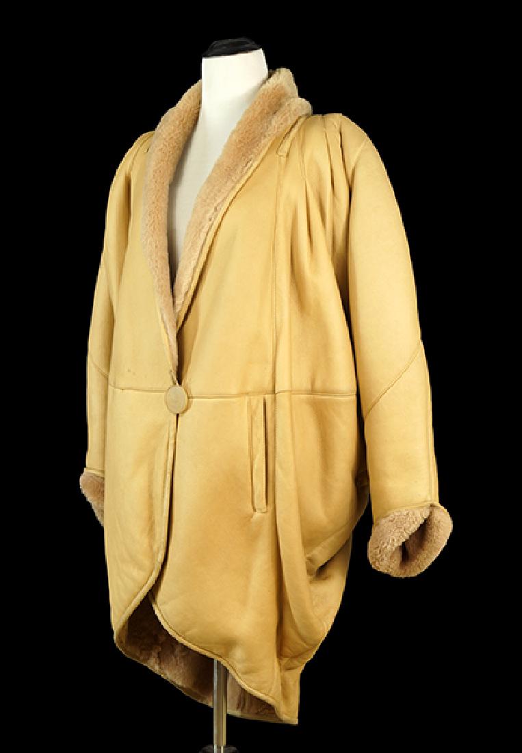 A Fendi Coat.: A Fendi Coat. Shearling coat with dolman sleeves and a single button closure Approximately a size 10 - 12