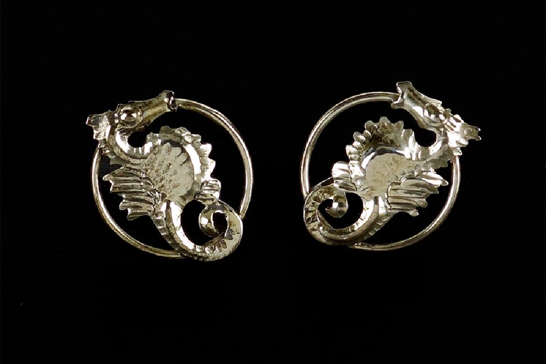 A Pair of Kalo Sterling Silver Earrings.: A Pair of Kalo Sterling Silver Earrings. Screwback earrings with seahorse form decoration diameter: .75"