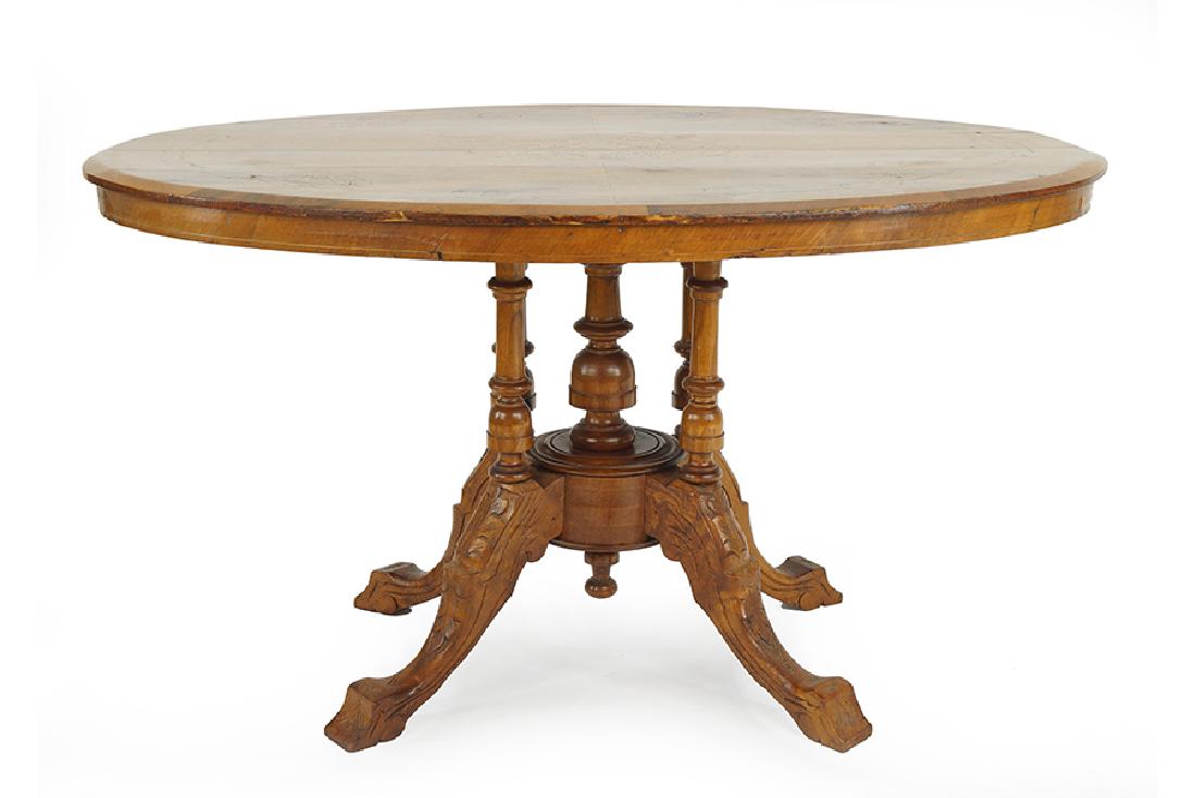 A Carved and Inlaid Mahogany Oval Tilt Top Table. (1 of 2)