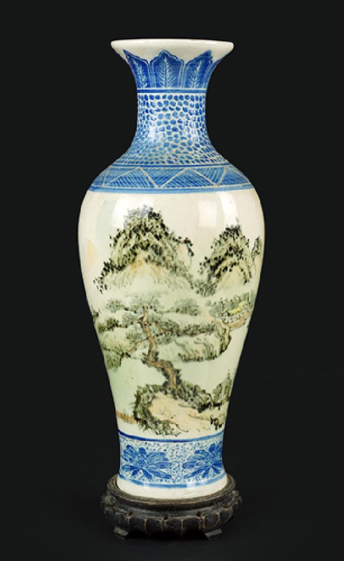 A Chinese Porcelain Vase.: A Chinese Porcelain Vase. With painted scene of a landscape, bearing an inscription at the shoulder and a wood base Height without Base: 16.25"