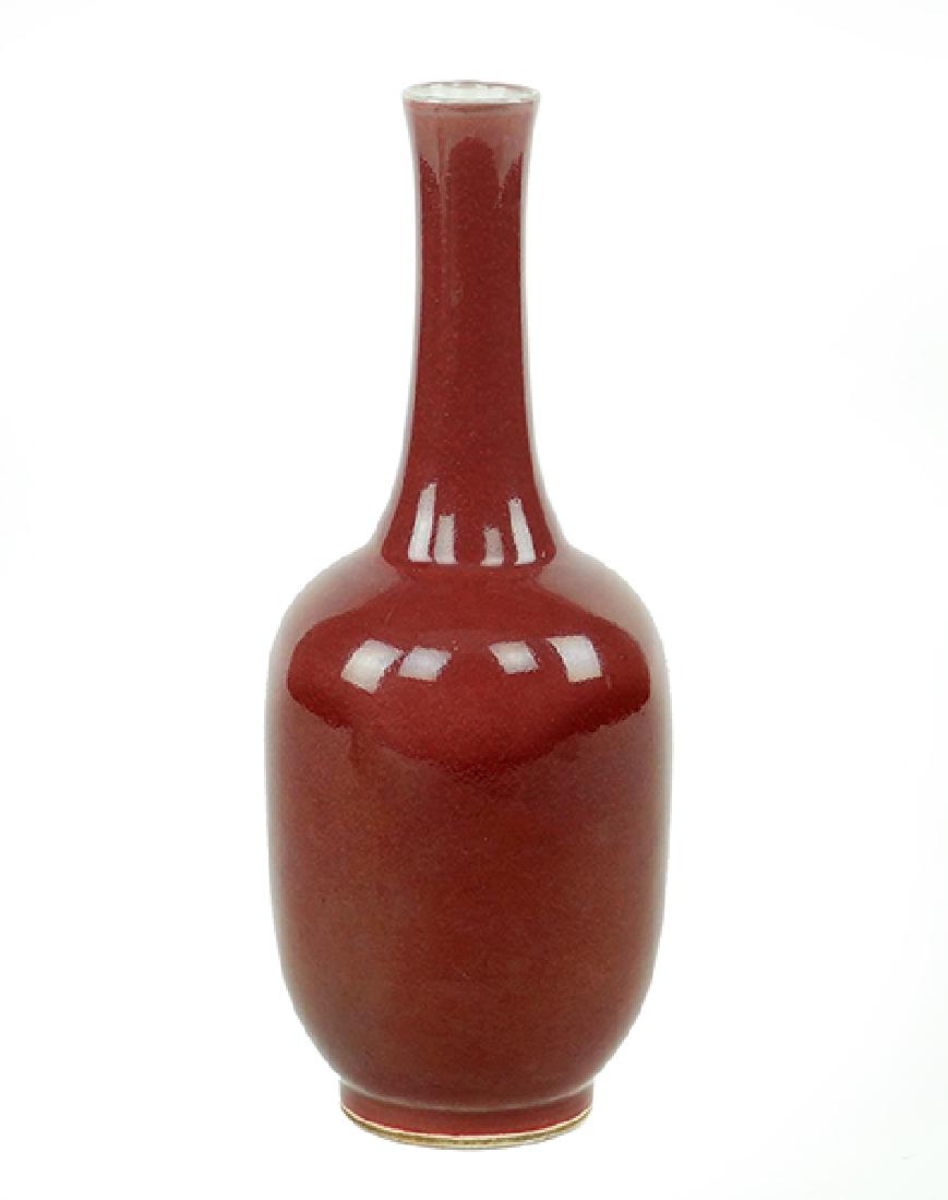 A Chinese Sang de Boeuf Bottle Form Vase.: A Chinese Sang de Boeuf Bottle Form Vase. Bearing an underglaze six-character Yongzheng mark on the underside Height: 8.5"