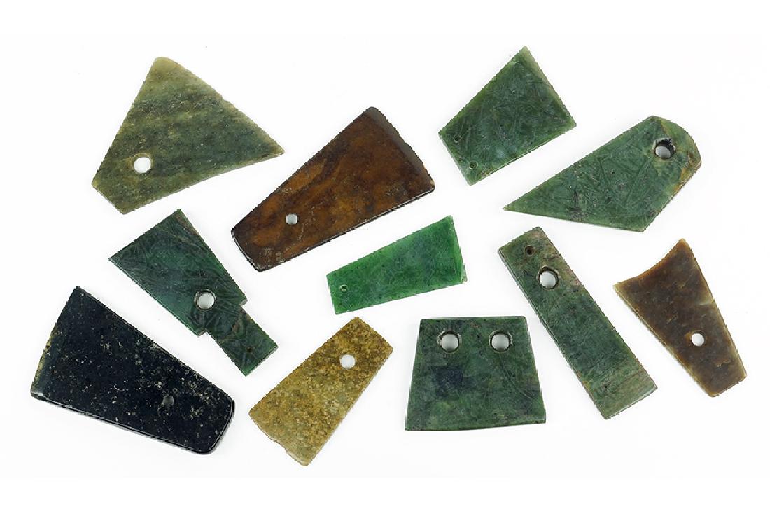 A Collection of Carved Stone Axe Heads. (1 of 1)