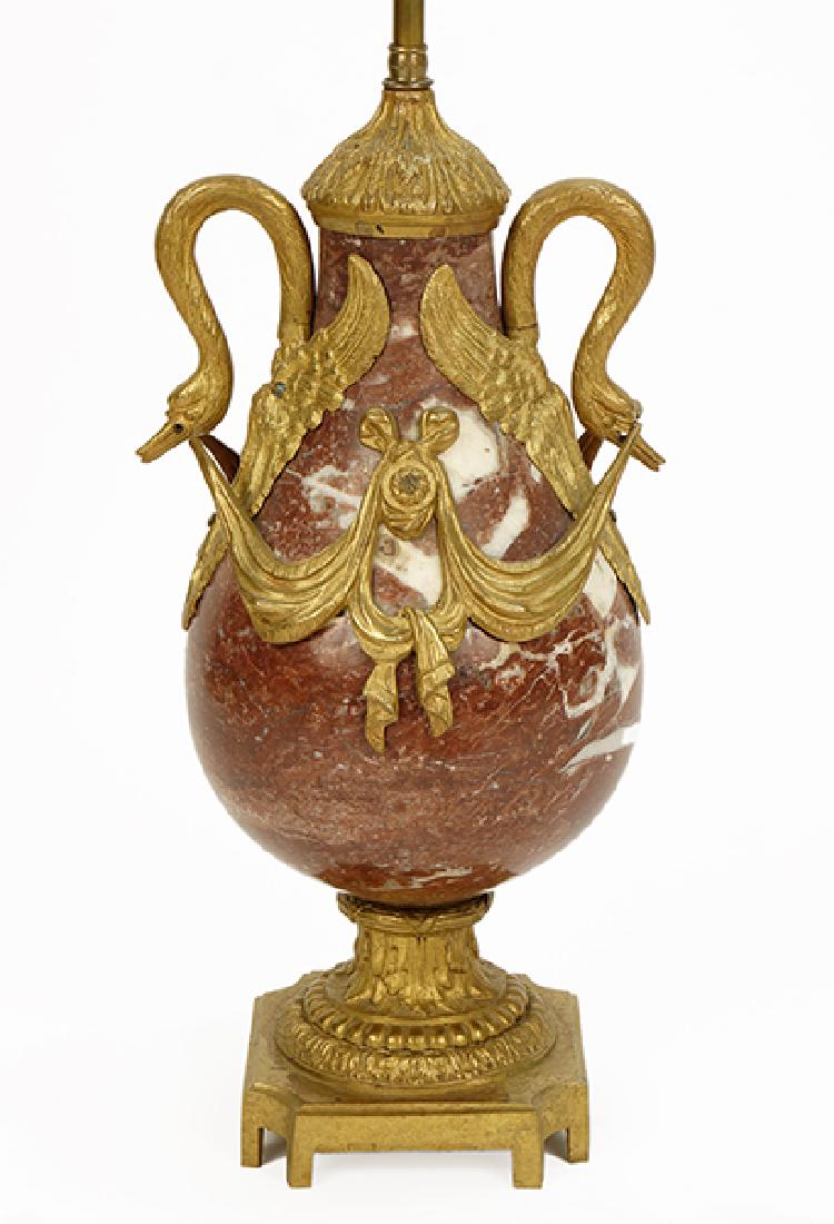 A French Rouge Marble Urn Lamp.: A French Rouge Marble Urn Lamp. With ormolu mounted bronze swan form adornments Height: 30.5"