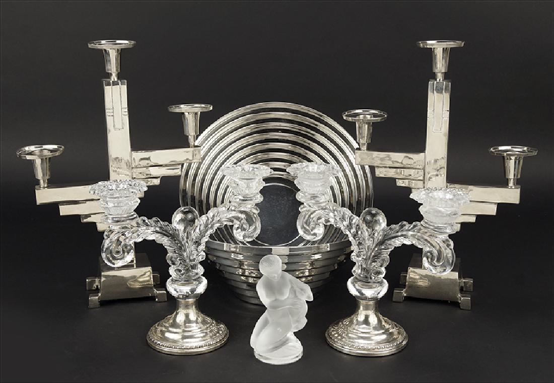A Pair Of Candelabra.: A Pair Of Candelabra. Weighted sterling silver bases with pressed glass two light candle cups. Together with a Lalique figure of a nude maiden with goat (4.75" x 2.5"), a pair of Alessi Italian bowls,
