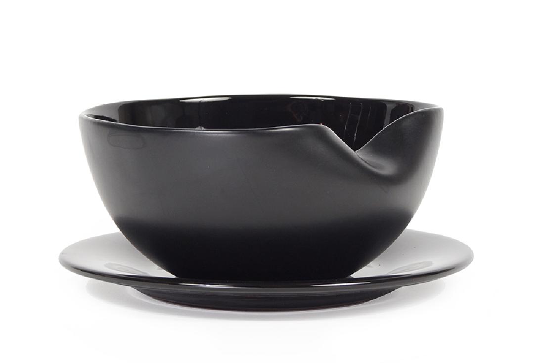 An Elsa Peretti for Tiffany & Company Ceramic: An Elsa Peretti for Tiffany & Company Ceramic Thumbprint Bowl. Together with an Elsa Peretti for Tiffany 7 company black ceramic plate (diameter: diameter: 8.5") Bowl: 3.5" x 7.5"