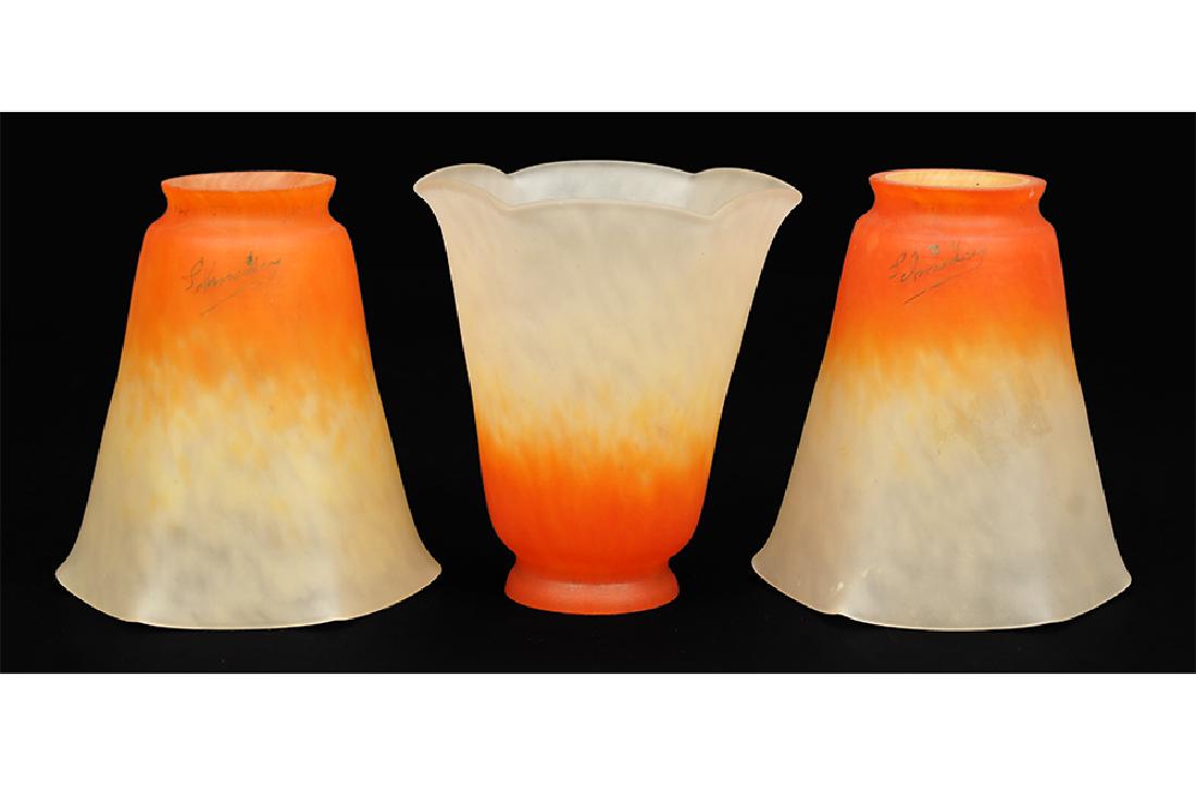 A Set of Three Schneider Glass Shades.: A Set of Three Schneider Glass Shades. Mottled white glass transitions to orange 5.5" x 4.25" x 4.75"