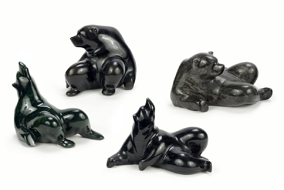 A Group Of Four Carved Stone Bears.: A Group Of Four Carved Stone Bears. Comprising four reclining bears, each signed David Wong Largest: 4.5" x 4.5" x 5"