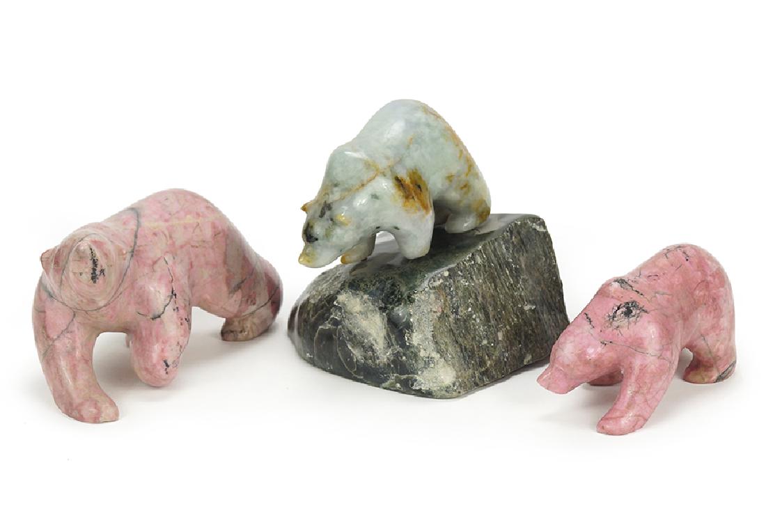 A Group Of Three Carved Stone Bears.: A Group Of Three Carved Stone Bears. Comprising two pink bears and one bear raised on a stone stand. Each signed David Wong Largest: 3.5" x 7" x 3"