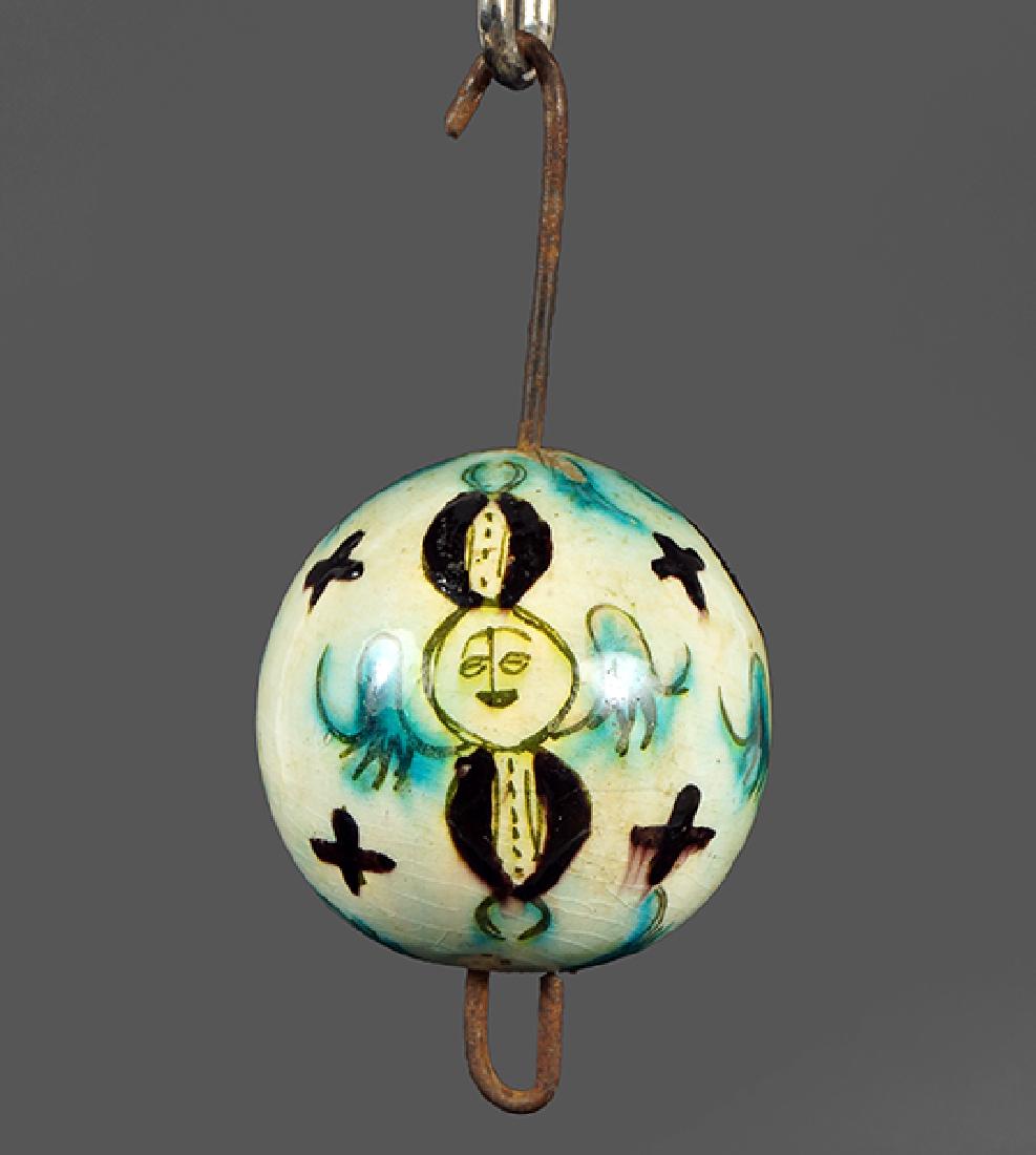 An 18th Century Armenian Kutahya Hanging Ornament.: An 18th Century Armenian Kutahya Hanging Ornament. Ottoman Period glazed pottery egg form ornament decorated with winged figures and crosses throughout ORnament: 3.25" x 3.25"