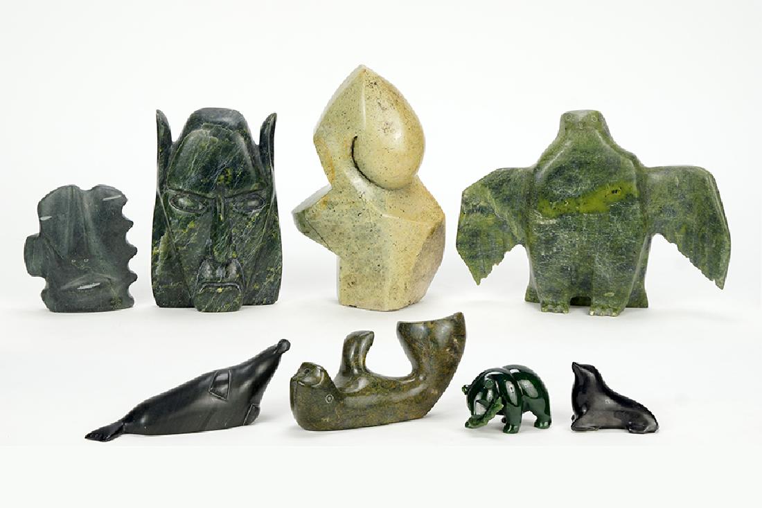 A Collection Of Carved Stone Sculptures.: A Collection Of Carved Stone Sculptures. Comprising two faces, two seals, a narwhal, a bear with fish, a bird, and an abstract Abstract: 8.5" x 5.5" x 3.5"