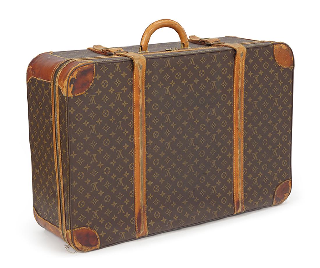A Louis Vuitton Suitcase.: A Louis Vuitton Suitcase. Monogrammed canvas and leather softsided suitcase. Monogrammed "WAD" on one leather corner 21" x 31" x 9.5"