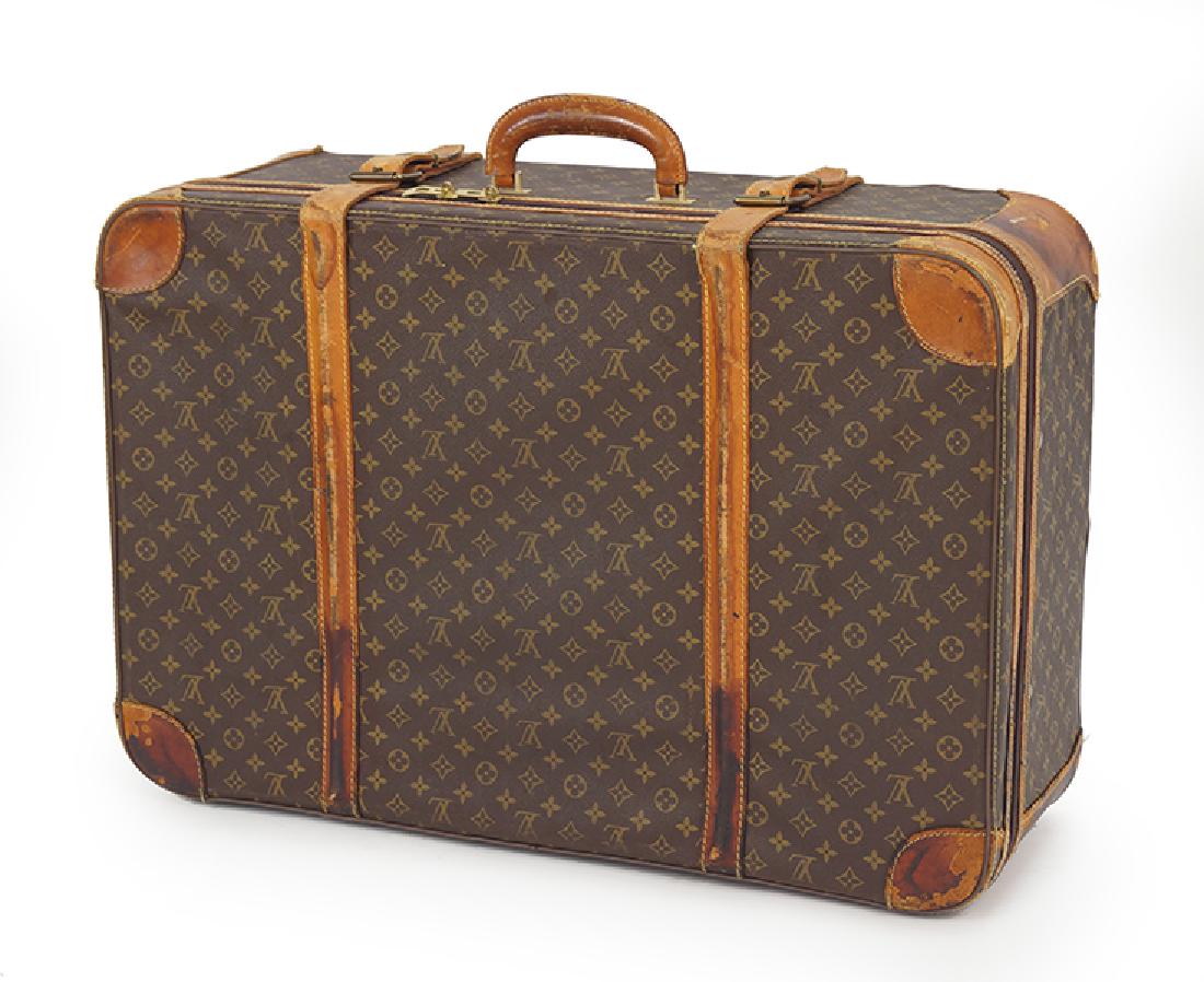 A Louis Vuitton Suitcase.: A Louis Vuitton Suitcase. Monogrammed canvas and leather softsided suitcase 21" x 31" x 10"