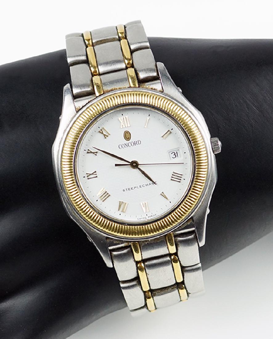 A Concord Steeplechase Watch.: A Concord Steeplechase Watch. Stainless steel link watch with a yellow gold bezel. Quartz movement. Case is numbered 868100 on the reverse. Susanin's will not comment on the working condition of any w