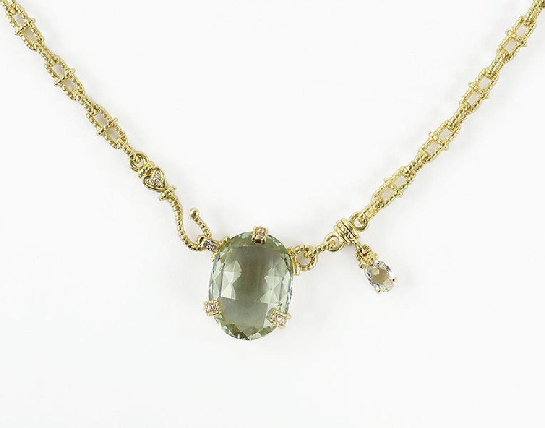 A Judith Ripka Green Amethyst Necklace.: A Judith Ripka Green Amethyst Necklace. 18 karat brushed yellow gold link necklace leads into a pendant containing a checkerboard faceted oval green amethyst. Amethyst is contained in the mounting wit
