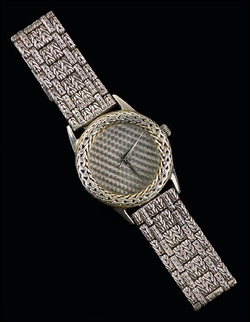 A John Hardy Sterling Silver Watch.: A John Hardy Sterling Silver Watch. Sterling silver basket weave dial with a woven bezel and sterling silver bracelet. Reverse of case is numbered "4874". Susanin's will not comment on the working con