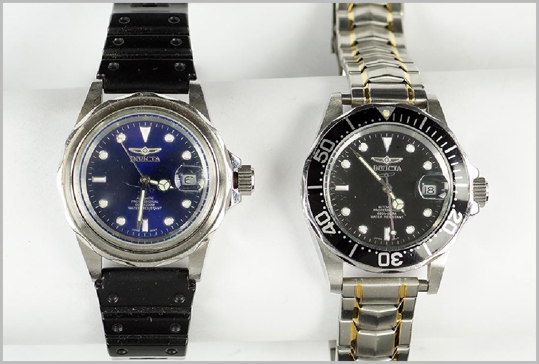 Two Invicta Men's Watches.: Two Invicta Men's Watches. Both with automatic movements. One with a black rubber bracelet and one with a two-tone stainless steel bracelet. Susanin's will not comment on the working condition of any