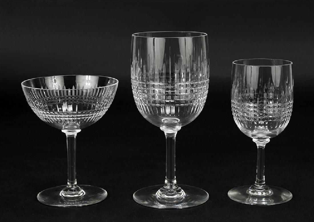 A Baccarat Crystal Stemware Service in the 'Nancy': A Baccarat Crystal Stemware Service in the 'Nancy' Pattern. Comprising sixteen water goblets (ht: 6 5/8"), ten champagne / sherberts (ht: 4 3/4"), and eighteen claret wine glasses (ht: 5 1/2")