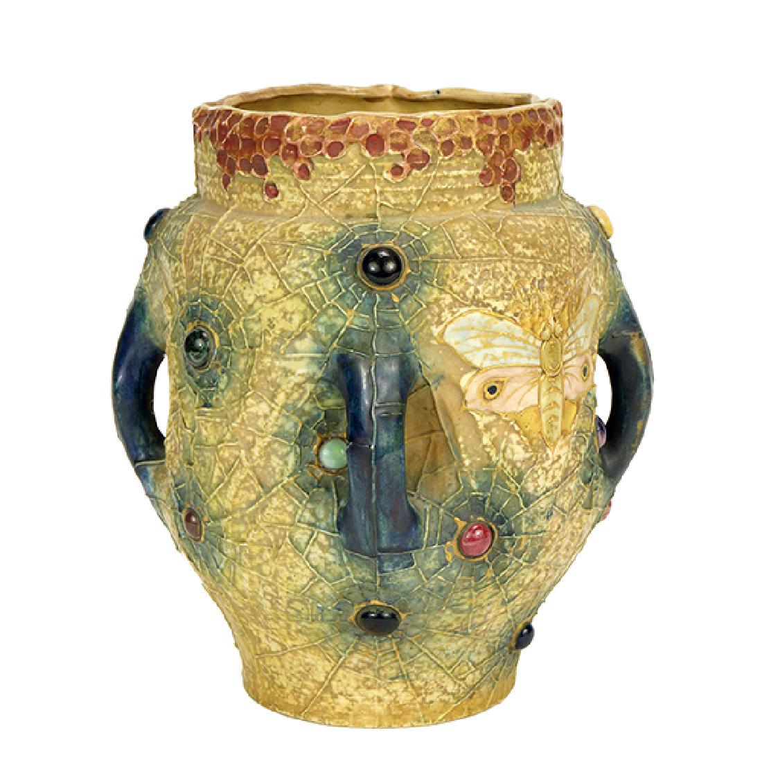 An Austrian Turn Teplitz Amphora Vase.: An Austrian Turn Teplitz Amphora Vase. Spider web decorated glazed pottery vase with moths and enameled "jewels" throughout. Underside is stamped 'Amphora Austria" with crown mark and 3549 9.5" x 8"