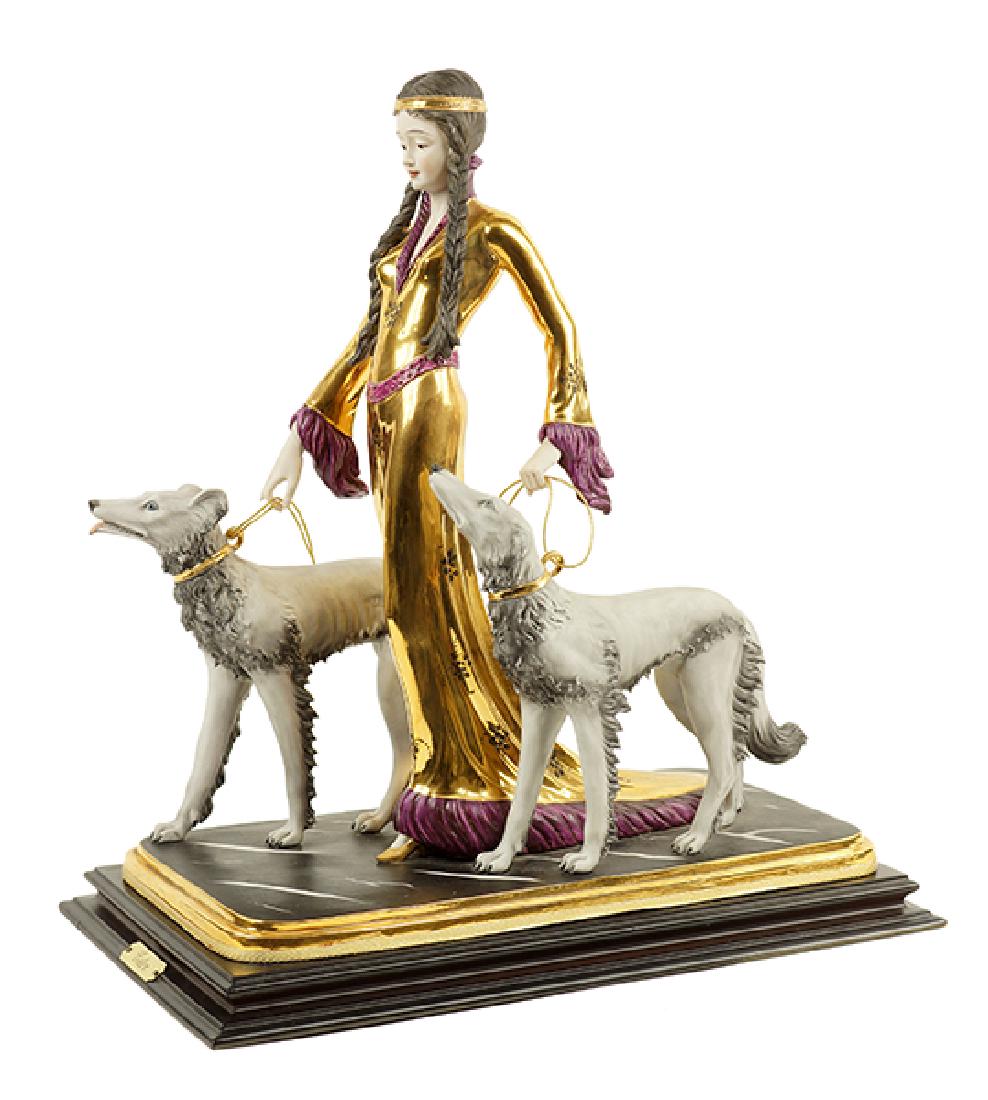 An Ester Bassano Porcelain Figure.: An Ester Bassano Porcelain Figure. Depicting a woman with two Borzoi dogs. Capodimonte porcelain, marked on base 16.5" x 16" x 9"