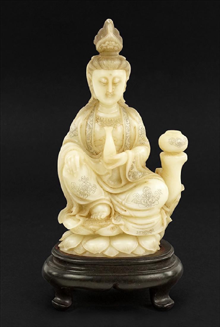 A Chinese Carved Soapstone Seated Guan Yin Figure.: A Chinese Carved Soapstone Seated Guan Yin Figure. Together with a fitted wood stand and box Soapstone: 7.25" x 4.25" x 2.25"