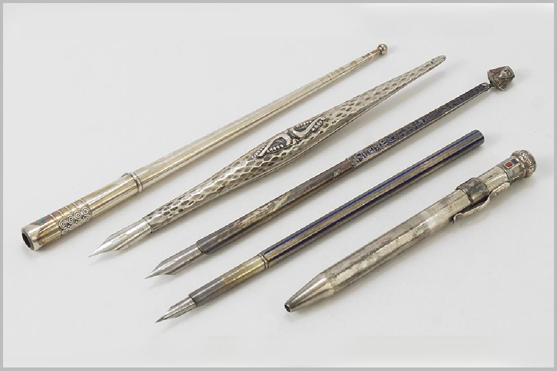 A Collection of Silver Pens.: A Collection of Silver Pens. Comprising an .830 silver dip pen, a .900 silver retractable pencil, a Russian .84 silver dip pen, an .830 silver and blue enamel dip pen and an .800 silver and blue ename