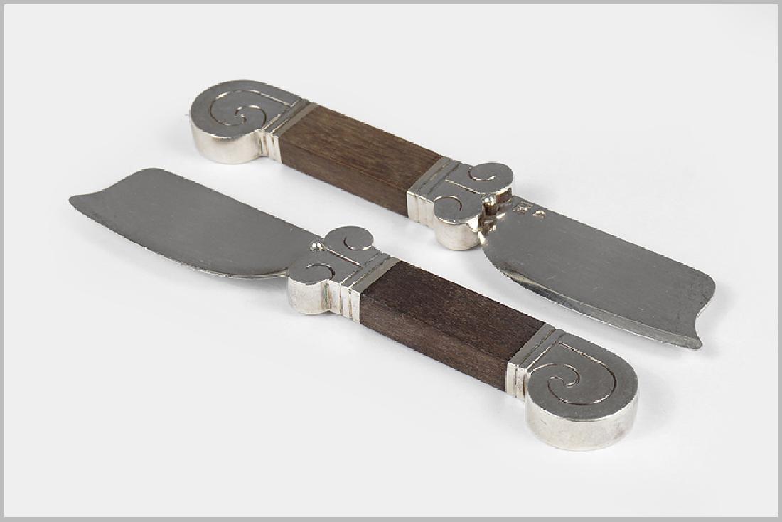 A Pair of Hector Aguilar Cheese Knives. (1 of 3)