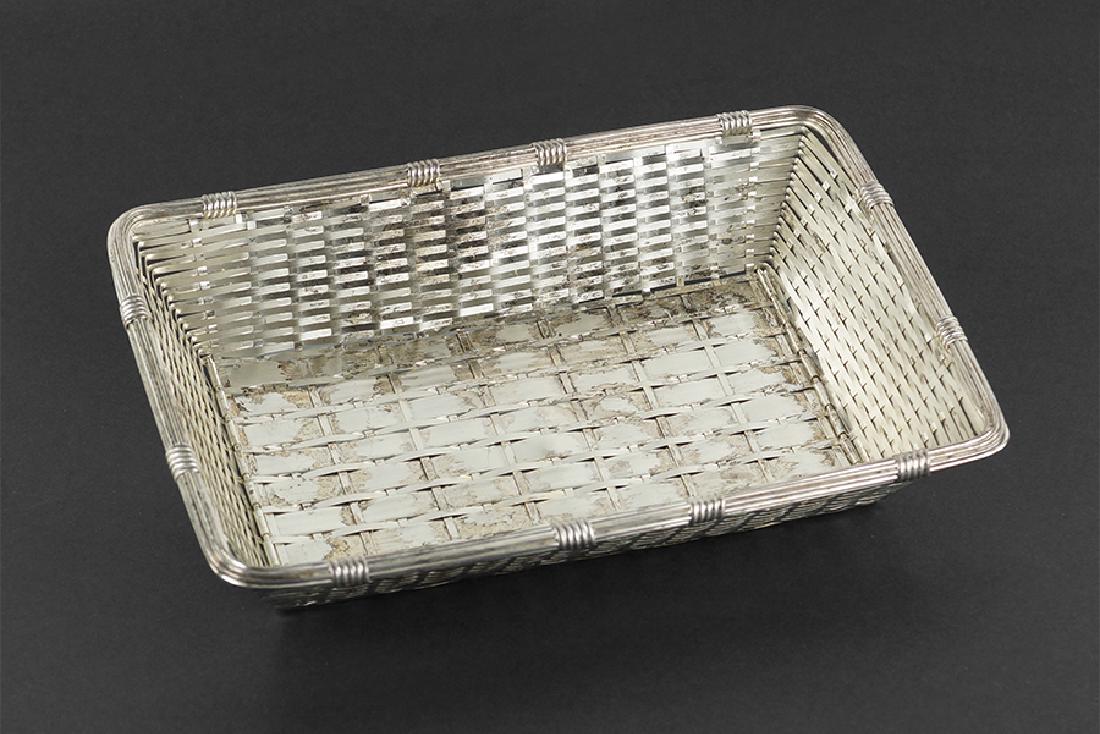 A Christofle Basket.: A Christofle Basket. Rectangular woven basket, stamped "Christofle" to the underside 2.25" x 10.75" x 7.25"