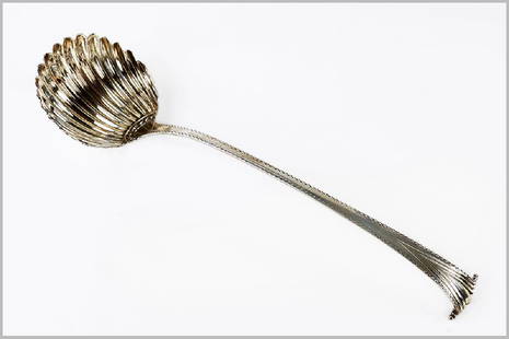 A George III Silver Ladle.: A George III Silver Ladle. English silver ladle marked for Hester Bateman, London, 1779. Shell form bowl with a feathered handle leading up to a fan Length: 14" Wt: 5.20 ozt