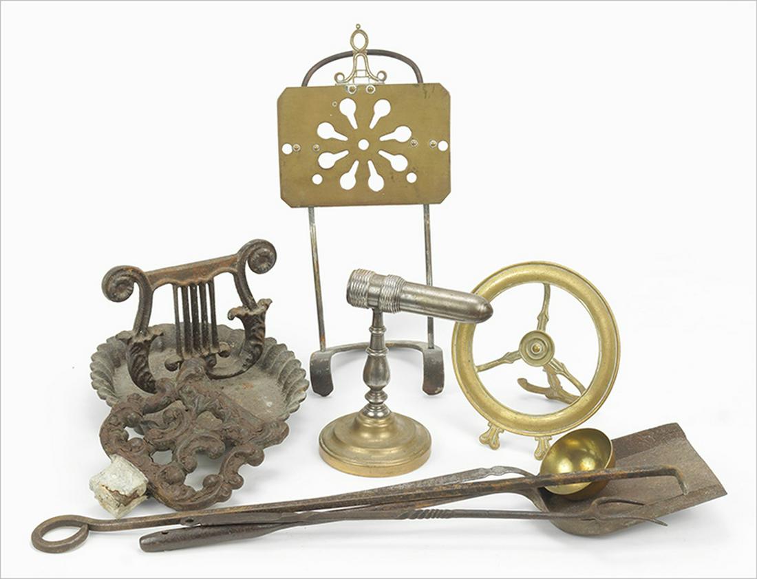 Two Iron Boot Scrapers.: Two Iron Boot Scrapers. Together with a brass trivet, a round brass frame, a goffering iron and four iron fireplace implements