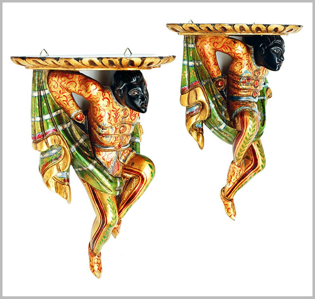 A Pair of Wall Brackets.: A Pair of Wall Brackets. Painted composite brackets with blackamoor and fabric swag supports 13.5" x 10.5" x 6.5"