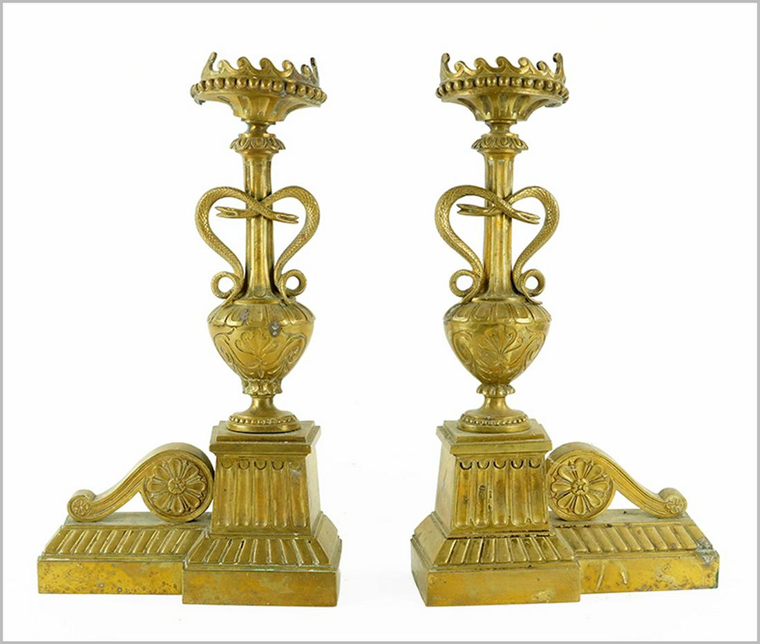 A Pair of Victorian Andirons.: A Pair of Victorian Andirons. Patinated brass andirons in the form of an urn with snakes wrapped around the central support 16.5" x 9.5" x 3.5"