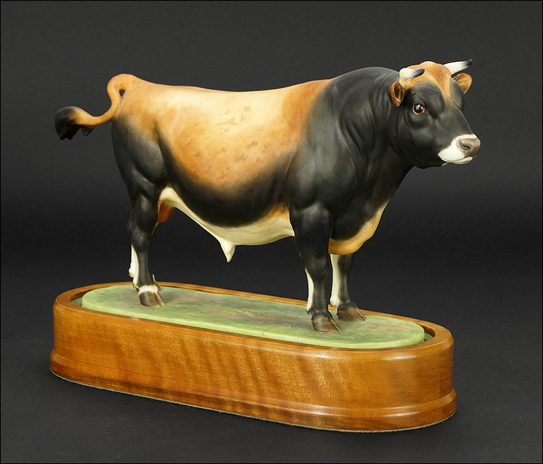 A Royal Worcester Porcelain Jersey Bull.: A Royal Worcester Porcelain Jersey Bull. With a wood stand Bull: 7" x 12" x 3"