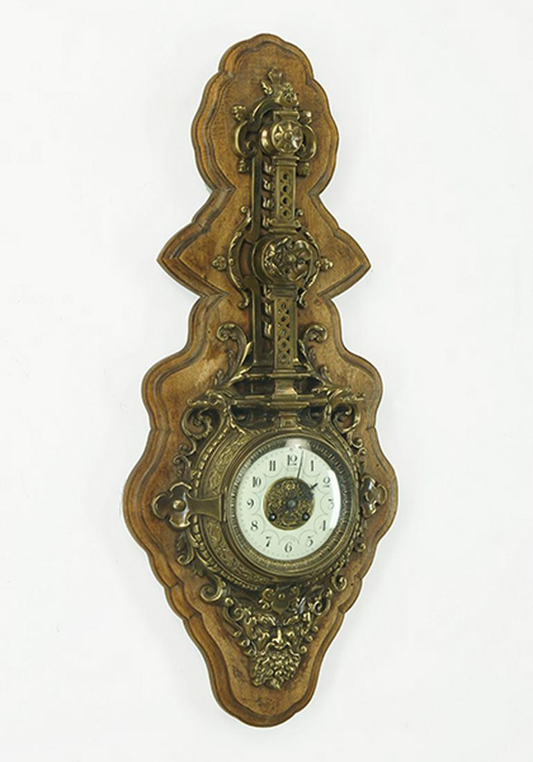 A French Wall Clock.: A French Wall Clock. Metal and wood clock with enamel face and Arabic numerals. Movement stamped "L. Marti et Cie" and "Medaille D'Argent 1889". Susanin's will not comment on the working condition of