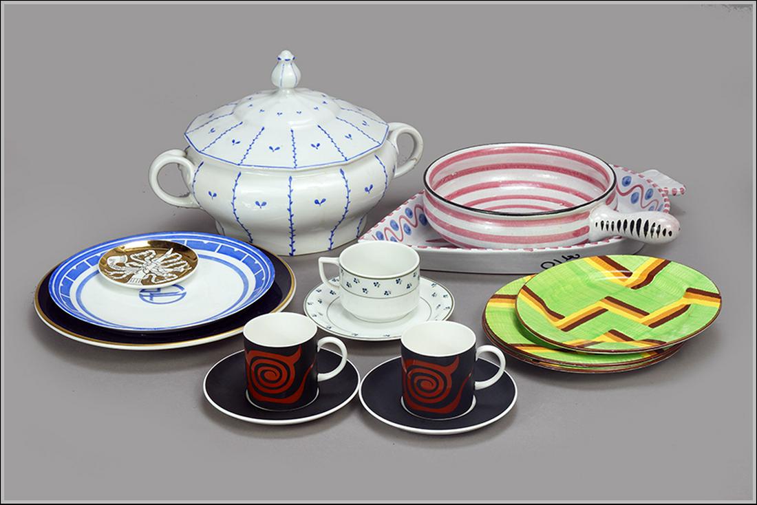 A Collection Of Porcelain Objects.: A Collection Of Porcelain Objects. Comprising a Fornasetti dish, three Majolika plates, two teacups with saucers by Wedgwood, a leaf form platter, a handled bowl, an Eva Zeisel plate, a teacup with sa