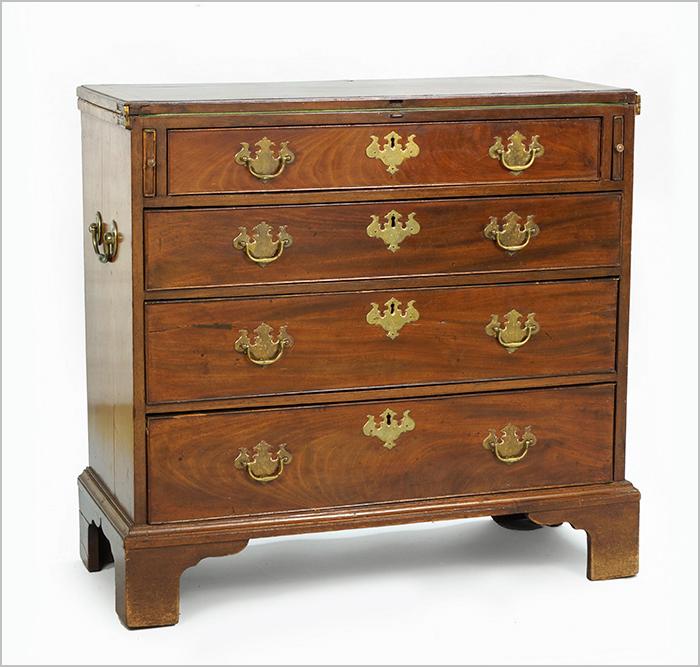 An English 18th Century George III Mahogany Bachelor's: An English 18th Century George III Mahogany Bachelor's Chest. Four drawer chest with flip top felt lined surface and two pullout supports 32" x 33" x 15"