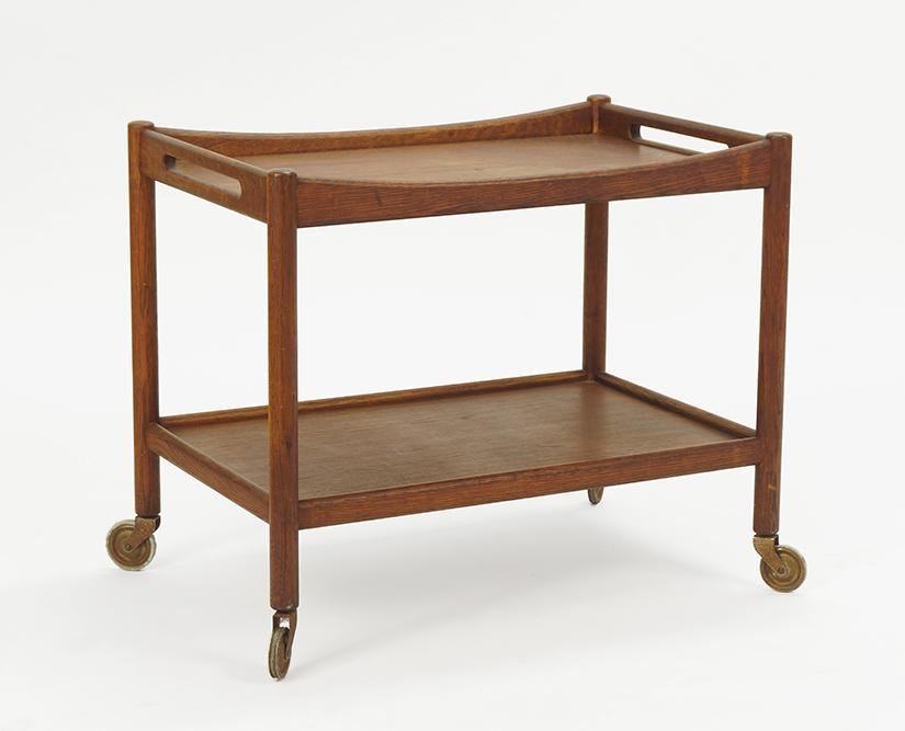 A Hans Wegner Teak Bar Cart.: A Hans Wegner Teak Bar Cart. Raised on casters. Underside reads "Fabrikat: andr. Tuck Arkitekt; Hans J. Wegner Denmark Made in Denmark" 24" x 28.5" x 18.5"