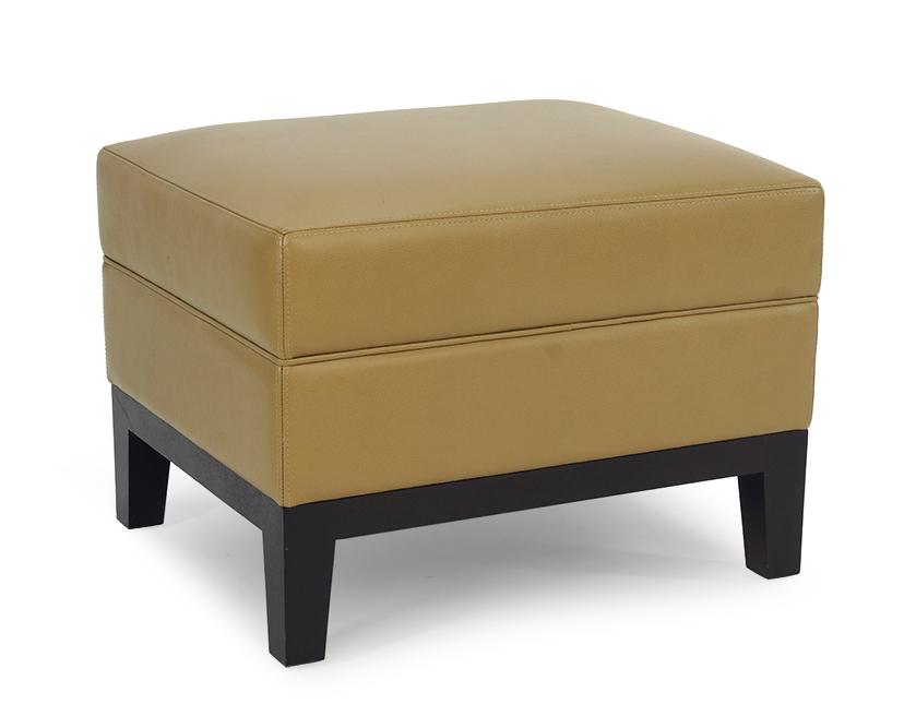 A Christian Liaigre for Holly Hunt Stool.: A Christian Liaigre for Holly Hunt Stool. Taupe leather ottoman raised on java finish legs 16" x 23" x 18"