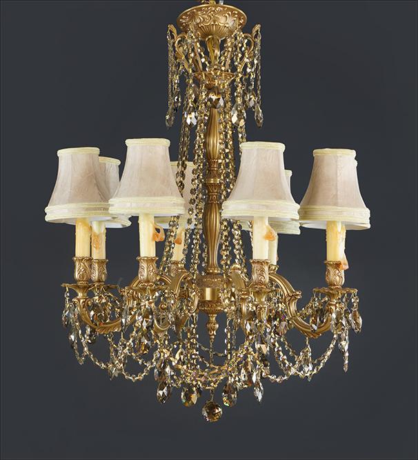 A Schonbek Brass and Crystal 8-Light Chandelier. (1 of 5)