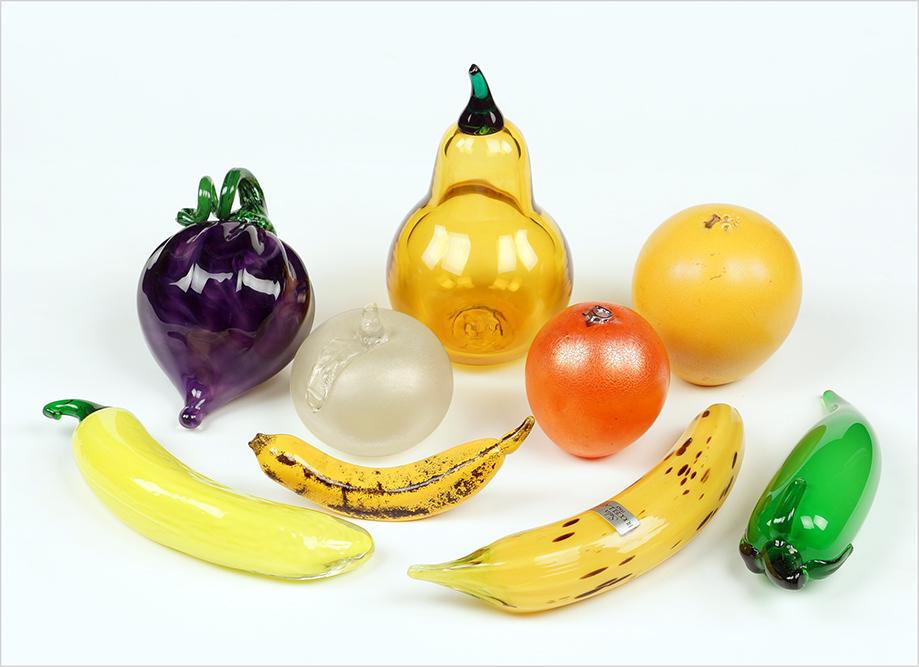 A Collection Of Glass Fruit.: A Collection Of Glass Fruit. Comprising a Buccellati Banana, a tangerine, an orange, and a banana all by Gozo Glass, a tomato by Silvestri, a pear, and a purple fruit Pear Height: 6.5"