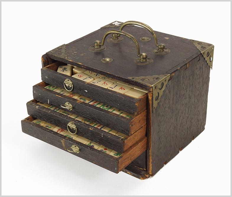 An Early 20th Century Mahjong Set.: An Early 20th Century Mahjong Set. Tiles of bone and bamboo, in wood case Case: 6" x 8" x 7.25"