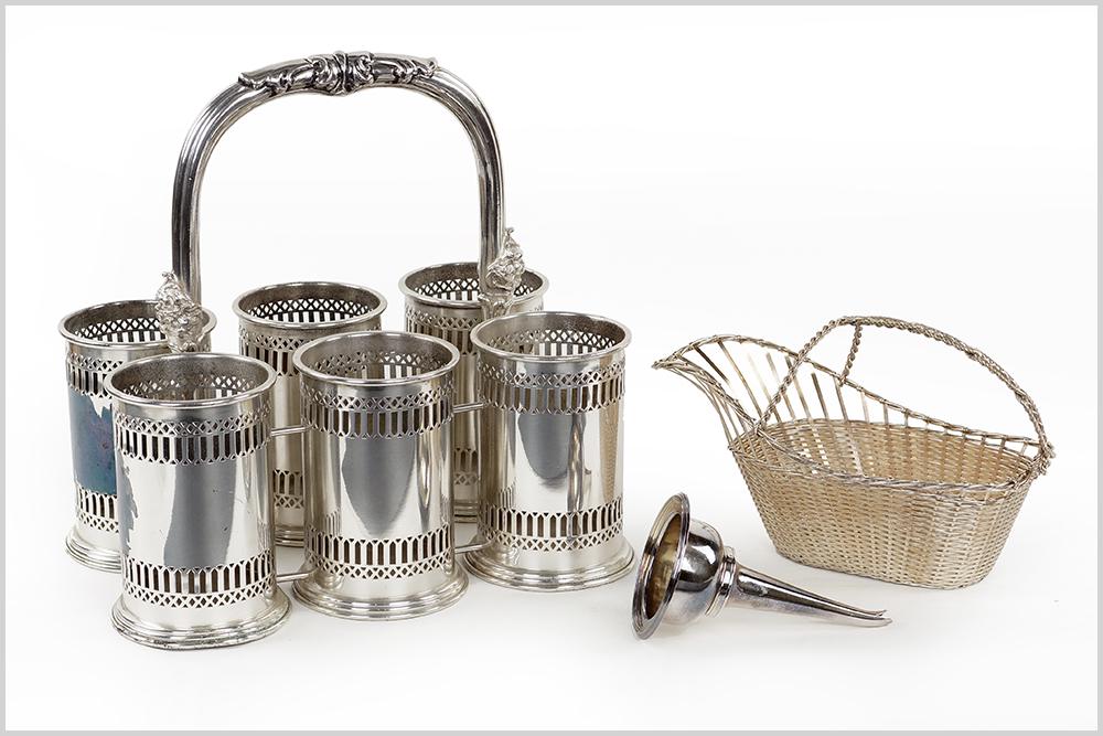 An English Silverplate Wine Funnel.: An English Silverplate Wine Funnel. Together with a French silverplate wirework wine bottle holder, and a handled silverplate six bottle carafe (13" x 13" x 9")