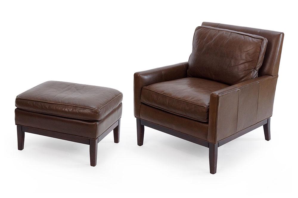 A Crate and Barrel Leather Upholstered Chair and: A Crate and Barrel Leather Upholstered Chair and Ottoman. Chair: 33" x 31" x 32"
